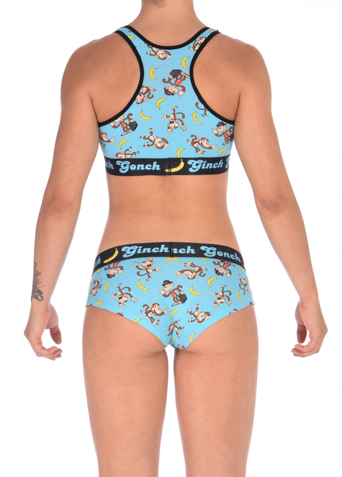 Ginch Gonch Monkey Business Women's Underwear boy cut brief, gogo, with blue background, monkeys, and bananas. Black trim and printed waistband with Ginch Gonch and bananas. Back. With matching sports bra.