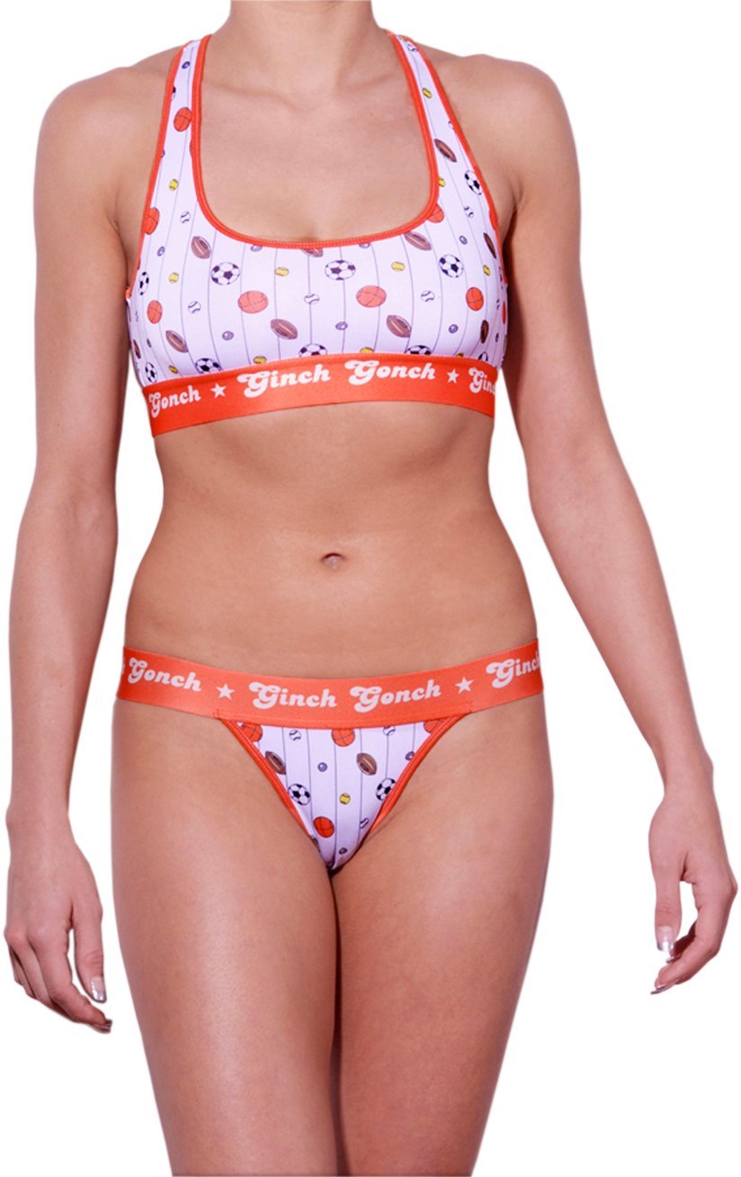 GG Ginch Gonch Hardball thong - women's Underwear - pin striped white fabric with basketballs, footballs, soccer balls, tennis balls, and baseballs. Orange trim with orange printed waistband front shown with matching sports bra